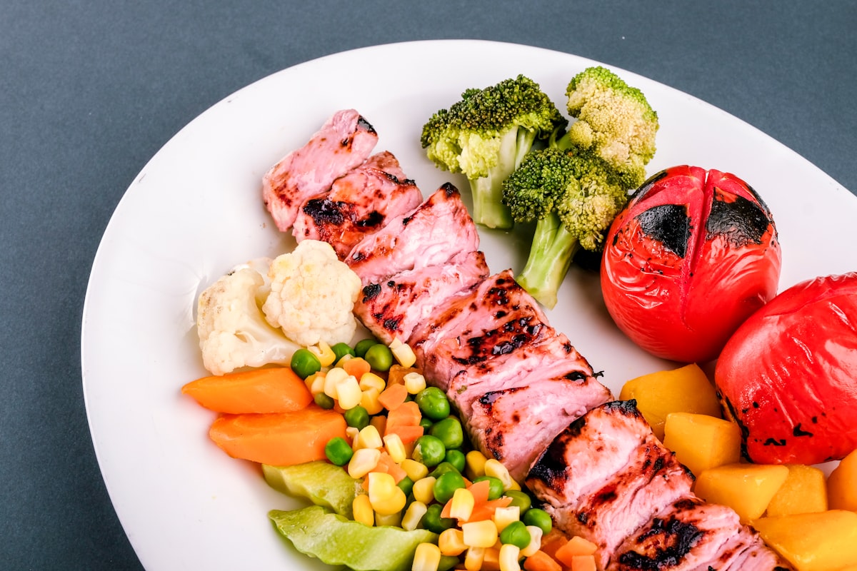 Active male athlete with balanced meal and supplements